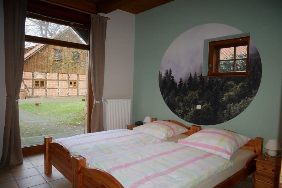Schlafzimmer der Ferienwohnung Hirschgrund auf dem Ferienhof Holste