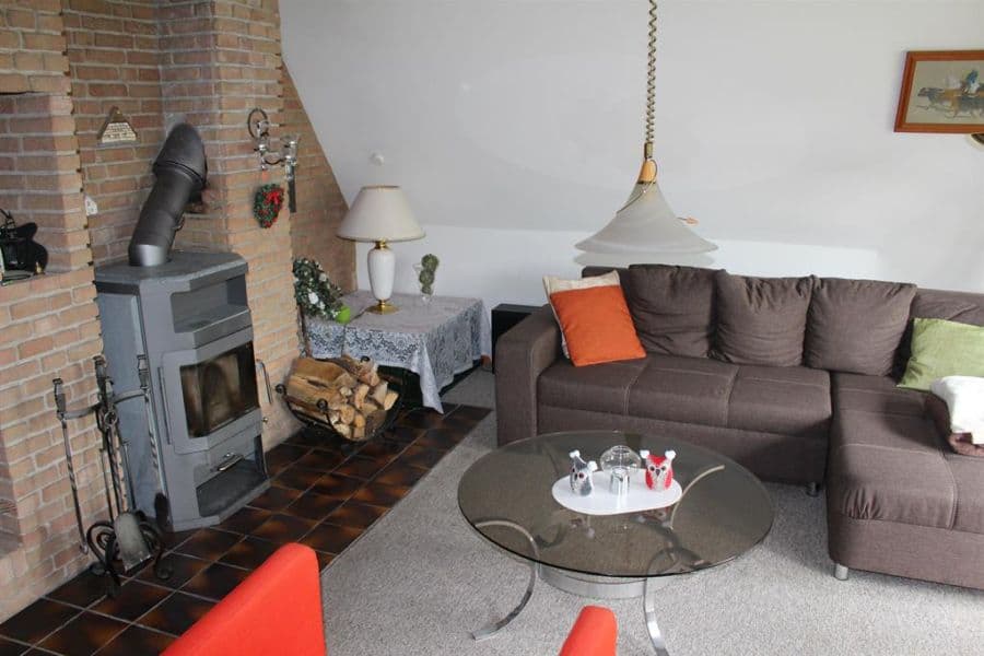 Wohnzimmer mit Kamin Heidehuus Petersen